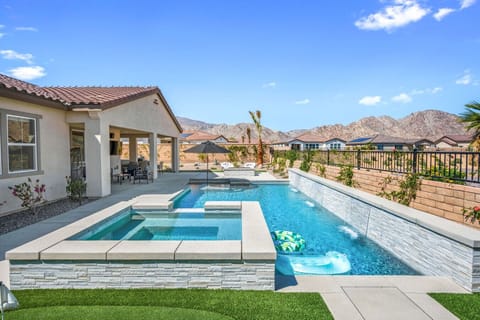 Sparkling pool & spa set against mountain views, perfect for sunny days & evening dips