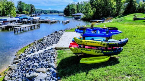 Backyard & Beach - Your kayak fleet lines the rocky shoreline, blue water and the quiet cove waiting the moment the coffee is done.