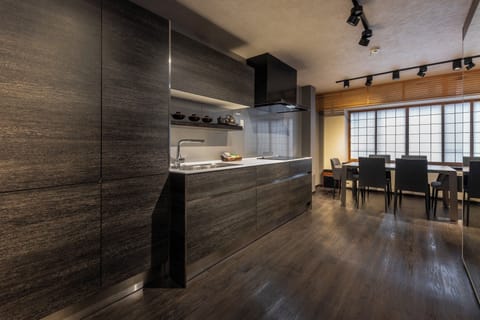 Townhome, 1 King Bed with Sofa bed, Non Smoking | Private kitchen | Electric kettle, dining tables