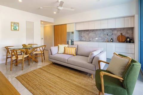 Bright open plan living area with modern coastal styling and comfortable seating