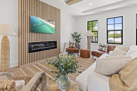 Sink into plush seating by your cozy fireplace, where natural textures and warm lighting create the perfect retreat after exploring.