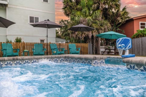 Our back yard has an in ground pool (non heated), built in hot tub, shade, lounge furniture, pool toys, and a picnic table.