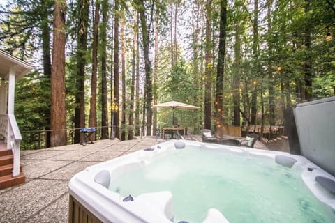 Hot tub features multi-colored lights, massaging jets, and views of the...