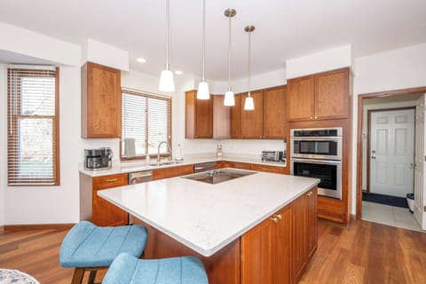 The chic, open kitchen offers ample space & every home comfort