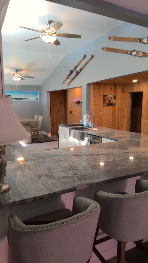 The upstairs kitchen with beautiful granite countertops