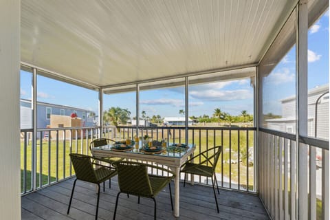 Enjoy meals with a view in this bright, airy space filled with sunshine and swaying palms.