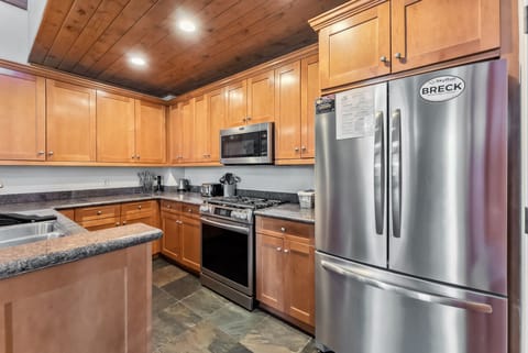 Kitchen: Main floor, drip coffee maker, Keurig, toaster, cooking utensils, tableware