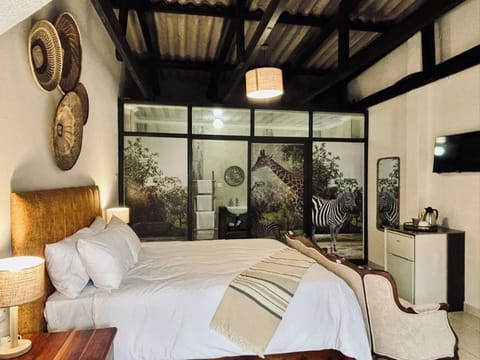 Double Room, Garden View | Iron/ironing board, free WiFi