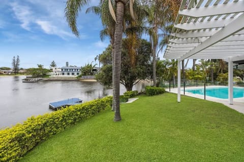 Enjoy a 42m of tranquil water frontage with lush lawn and poolside views.