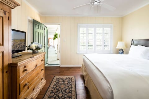 A charming and sunlit bedroom with rustic touches and a peaceful ambiance.