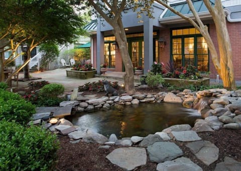 A tranquil garden oasis with a serene koi pond, perfect for relaxation and reflection.