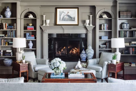 Cozy up by the fire in this inviting library lounge, where timeless charm meets modern comfort.
