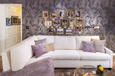 A cozy yet sophisticated space, designed for relaxation with soft hues and artistic touches.