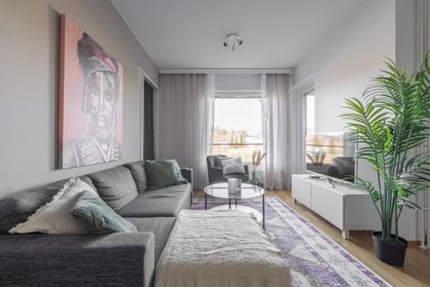 Comfort Apartment, City View | Living area | 50-inch Smart TV with digital channels