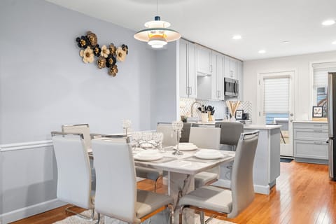 Stylish dining area next to the kitchen, featuring a sleek table.