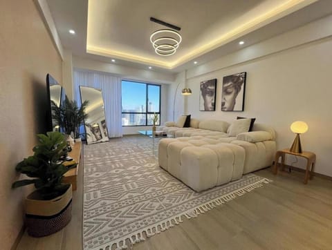 Deluxe Apartment | Living area | Flat-screen TV