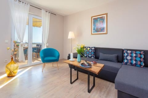 Apartment, Balcony, Partial Sea View | Living area | 32-inch flat-screen TV with cable channels