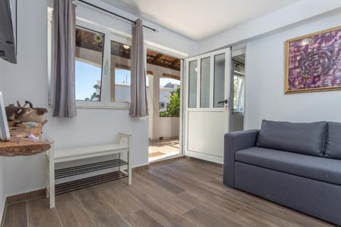 Apartment, Patio, Garden View | Living area | 32-inch flat-screen TV with cable channels