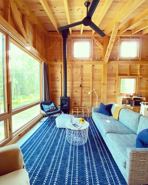 The living area offers comfy seating and a gas fireplace for cozy evenings.