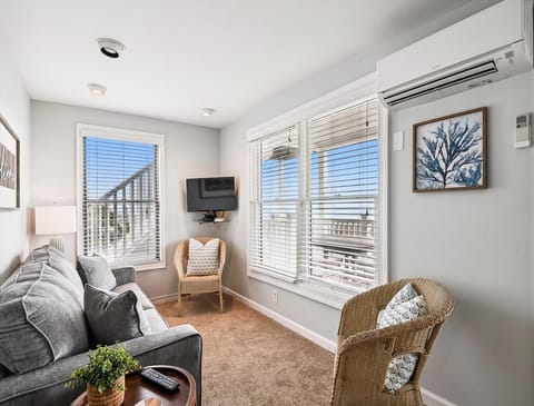 Cozy living space with a comfortable sofa and entertainment setup, perfect for relaxing evenings.