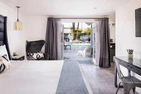 Deluxe Room, 1 King Bed, Pool View | Pillowtop beds, in-room safe, desk, blackout drapes