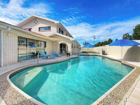 Float in the sparkling saltwater pool, bask in the Queensland sun, or enjoy a cool drink while the kids and pups play in the fenced yard.