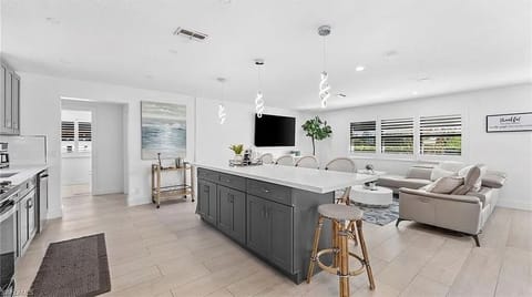 A large island, premium appliances, and spacious seating make cooking and entertaining effortless