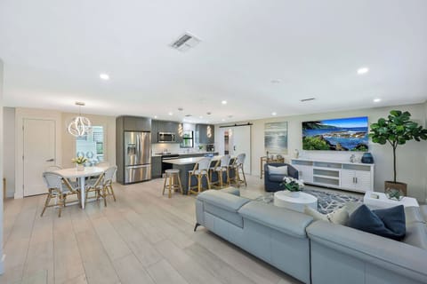 Spacious design lets everyone stay connected across the kitchen, dining, and living areas