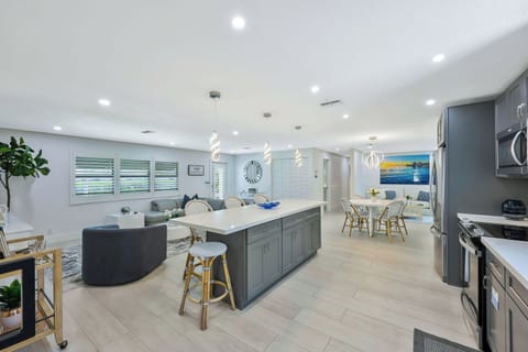 High-end finishes and warm coastal touches set the mood for relaxed gatherings and memorable meals