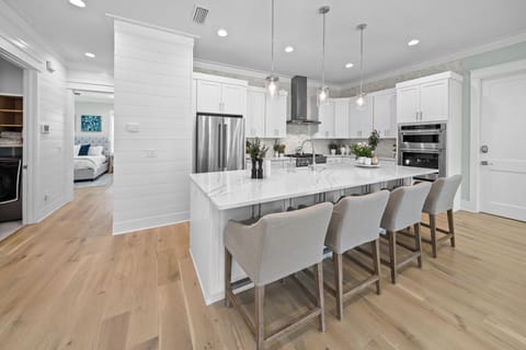 Large kitchen island includes seating for an additional four.
