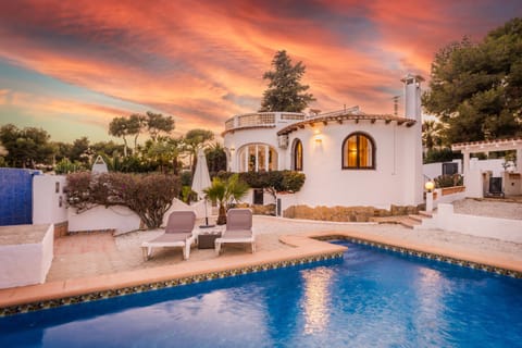 House and Pool by Night