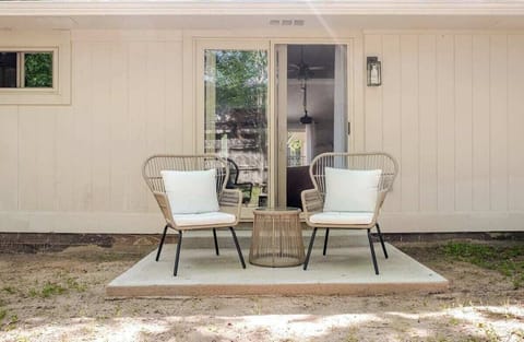 Generous private backyard oasis framed by majestic trees, relax in the shade.