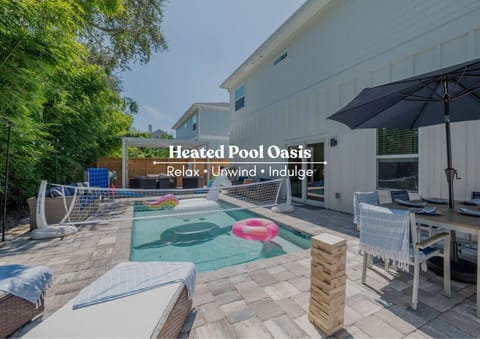Relax, unwind, and indulge by the private heated pool with outdoor dining and lounge space.