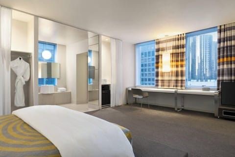 Wake up to city views and an airy open-plan layout.