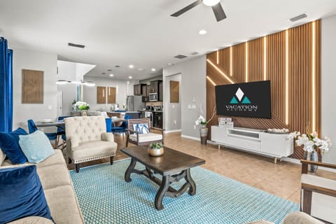 The living room is a great place for everyone to gather and it opens into the patio for Florida outdoor living.