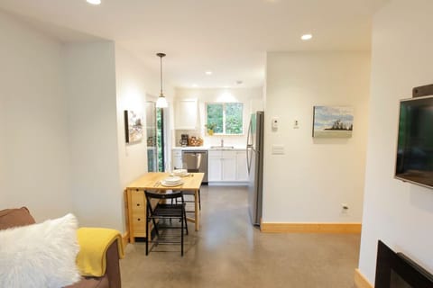View from living room into dining and kitchen spaces.