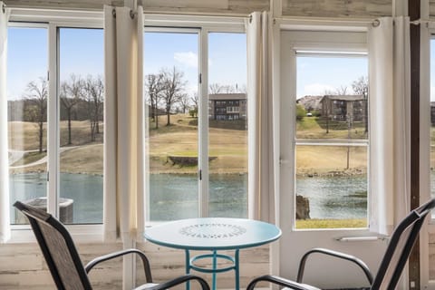 Sip your morning coffee in the sunroom with water & golf course views