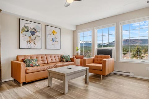 Living room with mountain views, a 50` Smart TV, board games, a gas-lit fireplace & a pull-out sofa bed for extra sleeping space (all necessary bedding provided.)