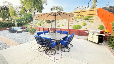 Outdoor dining seating for 8, relaxing fire pit, and grill to enjoy the summer. 
