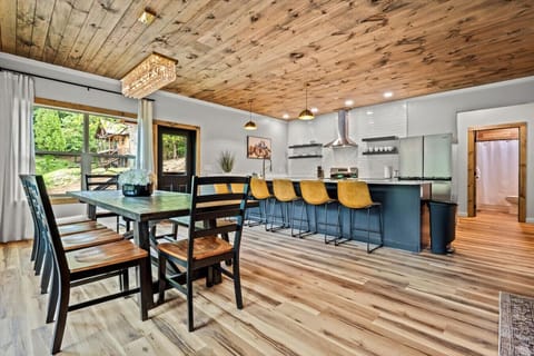 This wide-open layout brings together the dining area, kitchen, and living room—perfect for big family meals, game nights, and unforgettable vacation moments.