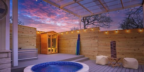 Outdoor Oasis: Unwind in the hot tub under sparkling lights and vibrant Texas sunsets!