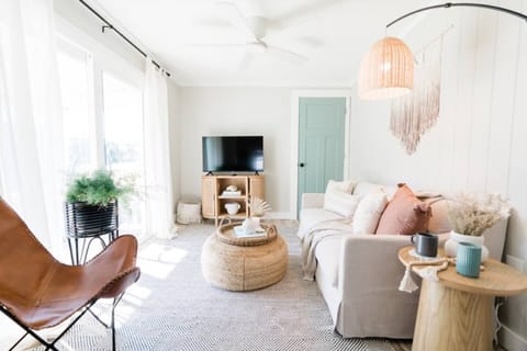 bright and airy living room with smart tv 