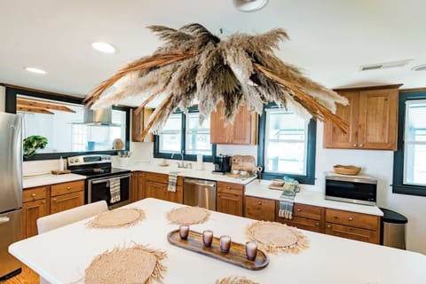 spacious kitchen with seating for 10! custom art made by local artist 