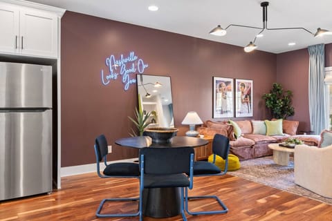 Open floor plan from the kitchen to living room, equipped with comfortable furnishings, plenty of natural light and all the kitchen essentials you would need. Seating at our dining table and the kitchen island.