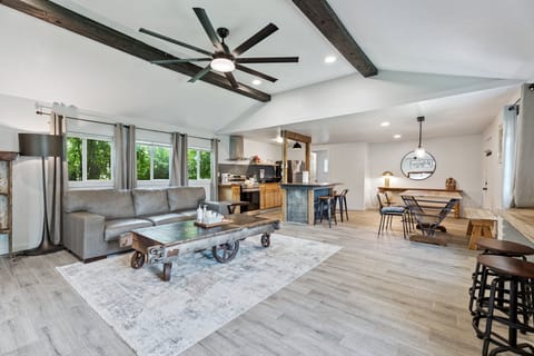 Enjoy seamless flow from the cozy sofa to the kitchen and dining areas—ideal for gathering, relaxing, and entertaining.