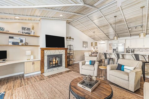 Seasonal fireplace, smart TV, and a work area featured in the living room