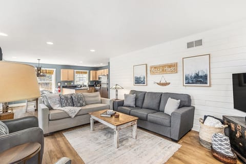 Open great room with living, dining, and kitchen space