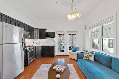 Seamless view from the bedroom into the open living & kitchen space.
