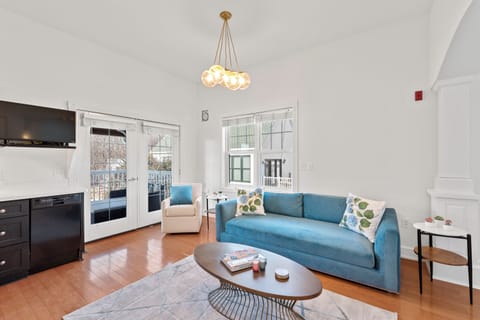 Bright, airy studio living area that flows easily for relaxing or stepping outside.