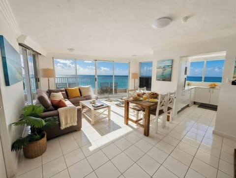 Light-filled living space with floor-to-ceiling windows and ocean views